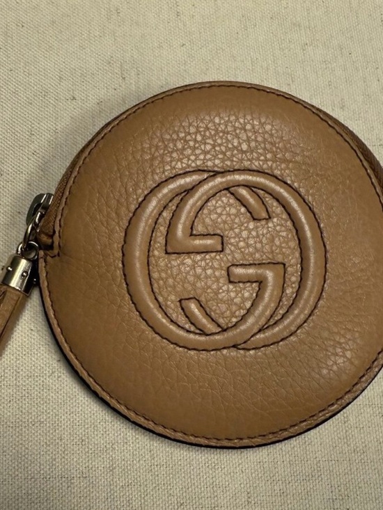Gucci Handbags - Gucci Tan Leather GG Embossed Round Coin Pouch